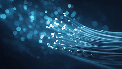 Abstract depiction of glowing blue fiber optic cables with bokeh effect on a dark background