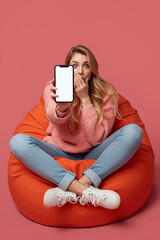 Woman in yellow jacket holding smartphone isolated on transparent background