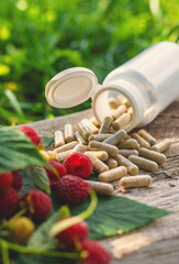 Raspberry leaf extract and supplements. Selective focus.