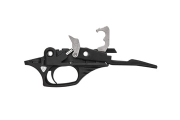 Precision-engineered firearm trigger unit in black finish, safety engaged, photographed on white.