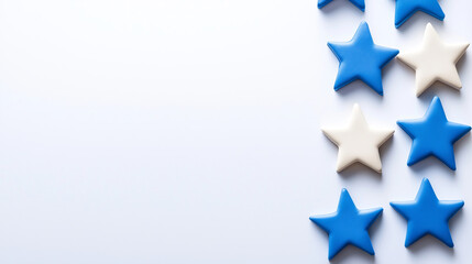 Blue and white star shapes arranged on light background create festive and cheerful atmosphere, perfect for celebrations