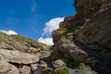 This landscape photo was taken in Europe, France, Auvergne Rhone Alpes, Haute Savoie, in summer. We can see the path on the rocks, under the Sun.