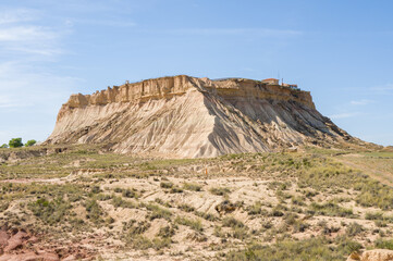 Fototapeta premium This landscape photo was taken in Europe, Spain, Navarre, in summer. It shows the military base in the Bardenas Reales, under the Sun.