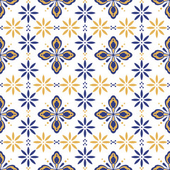 A vibrant, symmetrical pattern featuring floral shapes in blue and gold hues set against a white background, perfect for textiles or wallpapers.