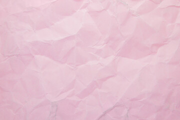 Fototapeta premium Soft pink wrinkled paper texture background for design and packaging mockups