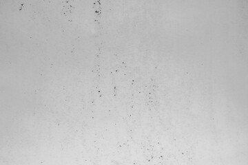 Light gray concrete wall texture background with subtle stains and rough surface