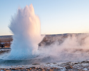 Strokkur Geyser Erupting in Winter at Geysir Geothermal Area, Iceland