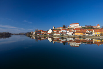 Obraz premium Ptuj castle and old town reflecting in Drava river, Slovenia