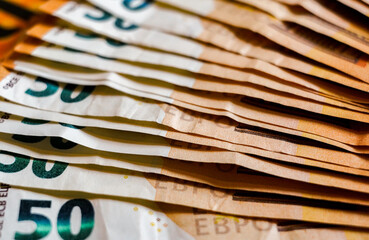 macro detail of a bunch of 50 euros banknotes