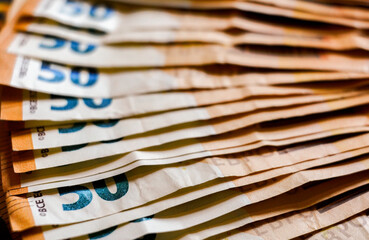 macro detail of a bunch of 50 euros banknotes