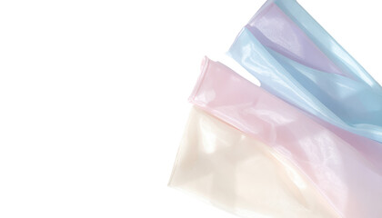 Obraz premium Smooth, iridescent fabric in delicate pastel shades of blue, pink, and cream creates a flowing backdrop, emphasizing a soft texture and luminous.