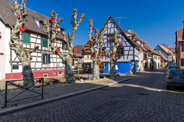 Alsace village street decorating for Valentine's Day with hearts