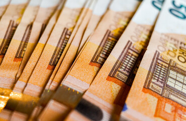 macro detail of a bunch of 50 euros banknotes