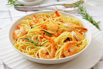 yummy spaghetti with shrimps in a white bowl