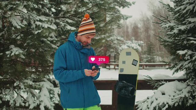 Snowboarder man rider in the snow at ski resort, using his smart phone while resting in the mountains, sport application, navigation and booking, communication, sport lifestyle