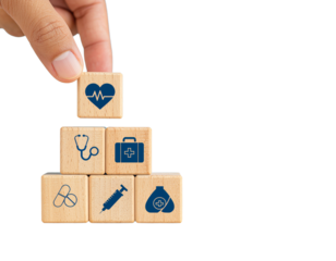 hand arranging four wooden blocks with healthcare icons on isolated background, isolated png with health icons, a pyramid of other medical symbols, representing health and wellness