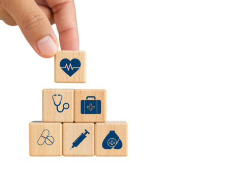 hand arranging four wooden blocks with healthcare icons on isolated background, isolated png with health icons, a pyramid of other medical symbols, representing health and wellness