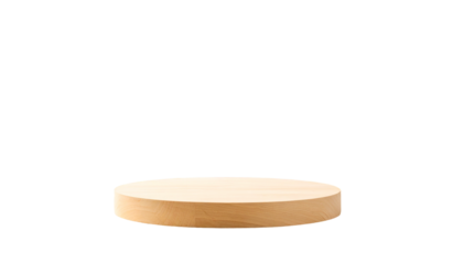 A circular, light-wood platform isolated against a stark black backdrop