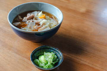 Japanese breakfast with pork soup and cucumber salad