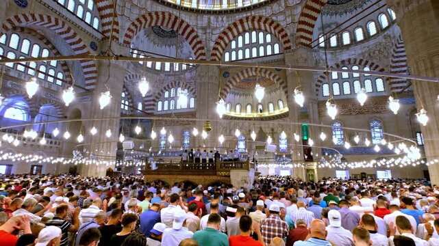 Muslim congregation performing prostration in a mosque. A spiritual moment symbolizing humility, devotion, and unity in Islamic worship.