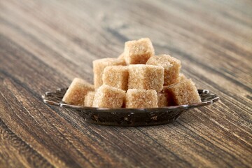 Ramadan concept, sugar in muslim bronze plate