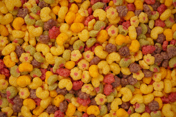 Sweet crunchy cornflakes as a background. Top view.