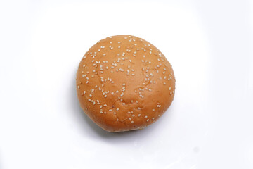 Round burger bun for sandwich isolated on white.