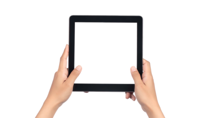 A person's hands holding a black tablet with a blank screen, against a black background