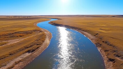 Aerial View of Meandering River in Dry, Sunny Landscape
