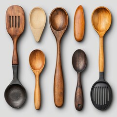 Assorted Wooden Spoons And Spatulas Against Gray Background