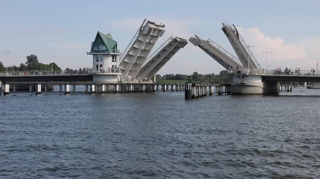 Modern Schlei bascule drawbridge in Kappeln slowly closing over water