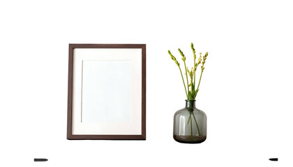 Wooden framed blank art beside a vase of flowers against a dark background