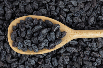 black raisins as a background. Top view. Flat lay