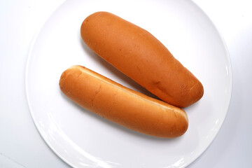 Assorted bread buns for hot dog on white background.