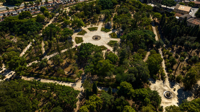 Aerial view of the central roundabout in Villa Giulia public park in Palermo, Sicily, Italy. It's one of the city's most beautiful green spaces, with many trees and flowerbeds.