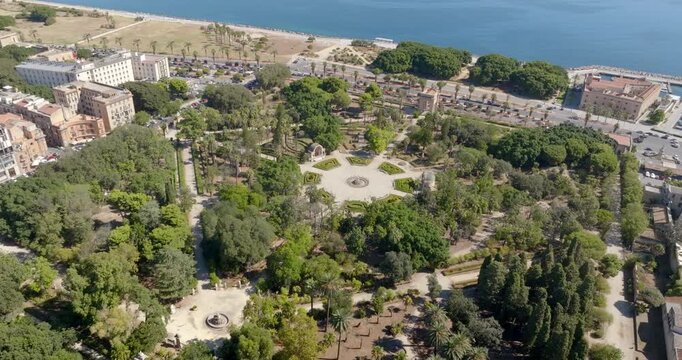 Aerial view of the central roundabout in Villa Giulia public park in Palermo, Sicily, Italy. It's one of the city's most beautiful green spaces, with many trees and flowerbeds.