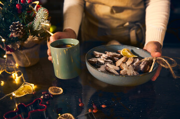 Cozy Holiday Kitchen Scene With Cookies, Tea, And Christmas Lights