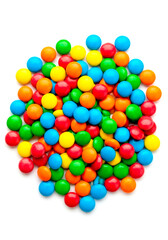 Obraz premium Sweet assortment of glossy bright candy lollipops scattered on a pristine white background. Colorful swirled tops, capturing playful sweetness and confectionery charm perfect for festive, dessert