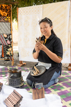 Indonesian artisan crafting traditional batik designs