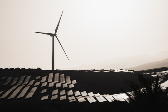 Wind turbine and solar panels harnessing clean energy