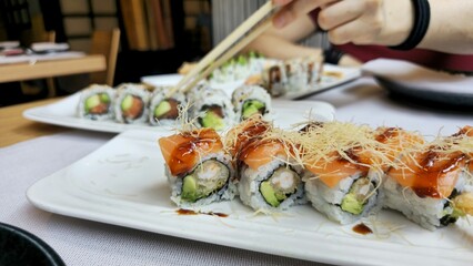Sushi feast with chopsticks and fresh ingredients