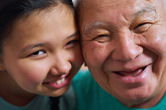 Senior man enjoying time with granddaughter