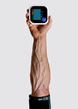 Blood pressure monitor shown in hand