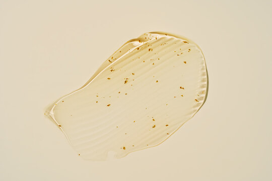 Transparent gel smear with subtle gold accents