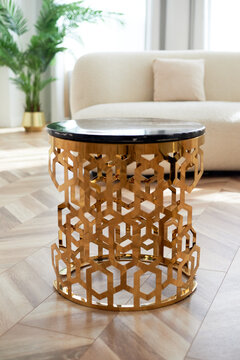 A golden chandelier with many light bulbs. Style, minimalism and luxury,