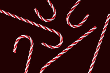 Festive candy canes on a dark Christmas background