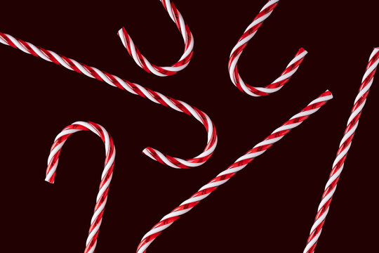 Festive candy canes on a dark Christmas background