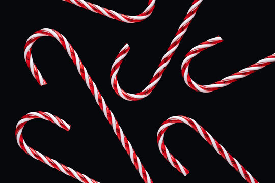 Festive candy canes on a dark Christmas background
