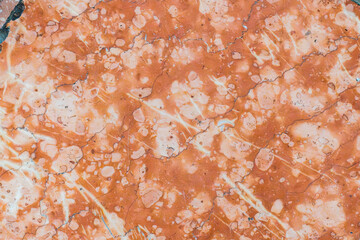 Vibrant orange marble texture with intricate patterns