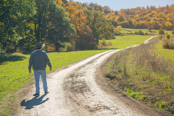 Fototapeta premium Man standing ground road in nature.